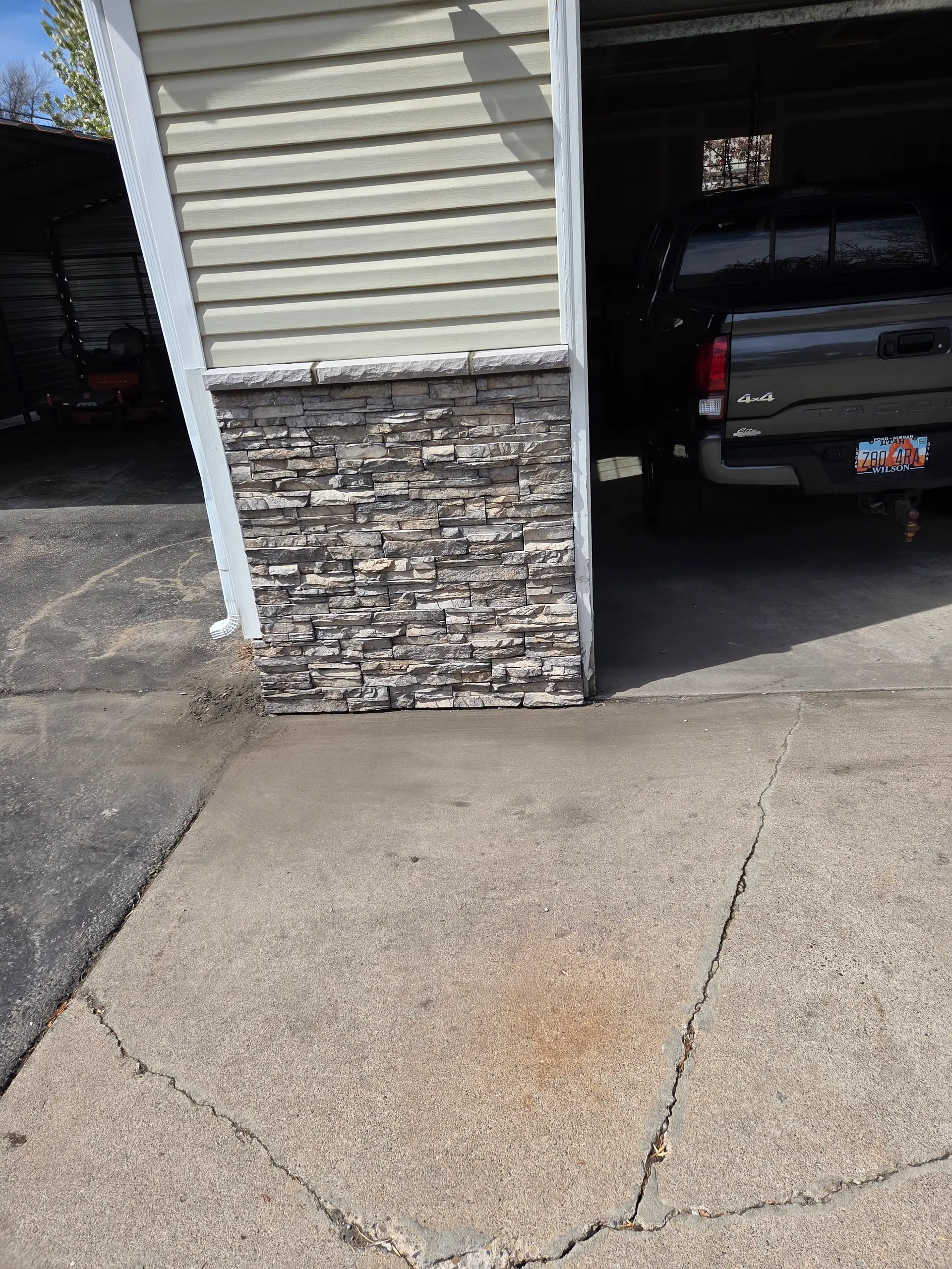 Detailed stacked stone work on a residential exterior column by Spackman Construction Services